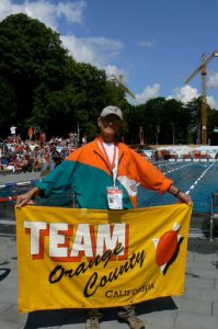 Richard Ammon with Team Orange County banner